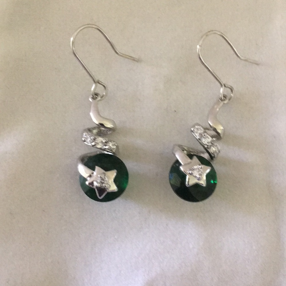 Pierced silver tone starburst earrings